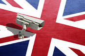 A CCTV camera against the UK flag