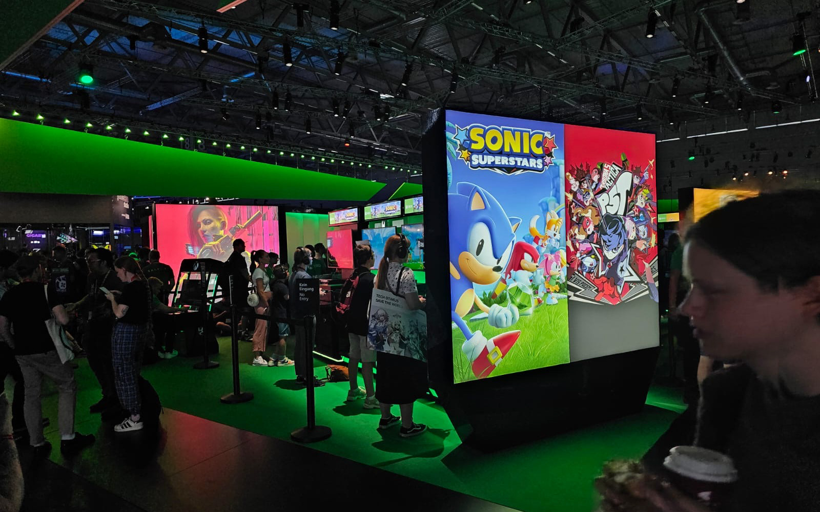 Xbox Booth image showing crowds playing Sonic Superstars and Persona 5 Tactica
