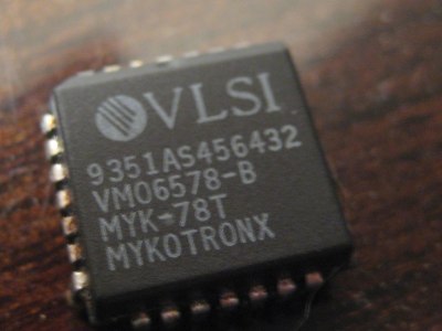 A quad flat-pack computer chip, made by VLSI